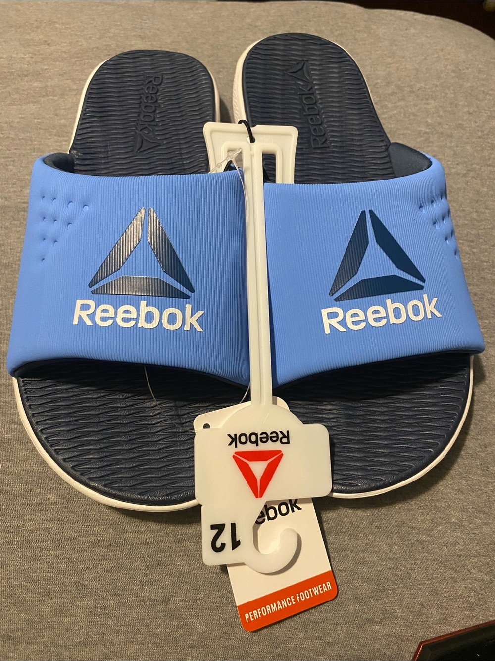 Reebok men’s Light Blue Slide Sandals with Navy Footbed